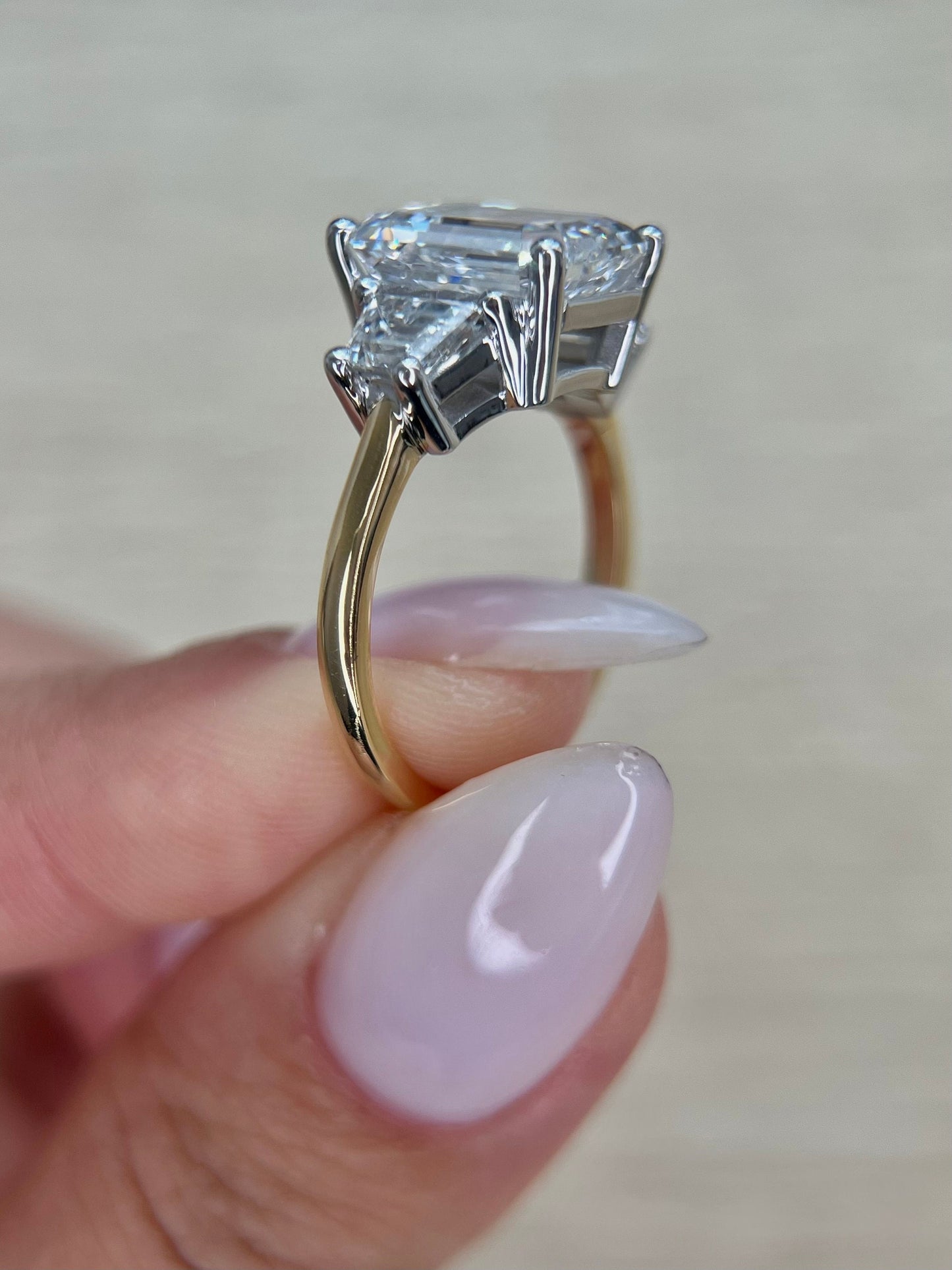 Special Two Tone Emerald Cut 5 carat IGI Certified E Color VVS2 Clarity Lab Grown Diamond Three Stone Engagement Ring, Side Trapezoids