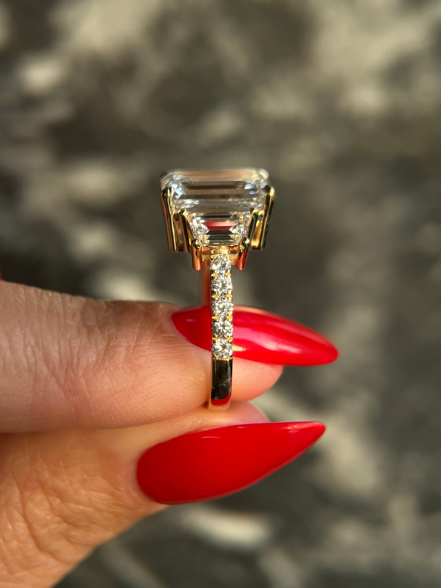 Emerald Cut 7.75 carat IGI Certified E Color VVS2 Lab Diamond Three Stone Engagement Ring, Side Trapezoids & Rounds, Handcrafted of Gold