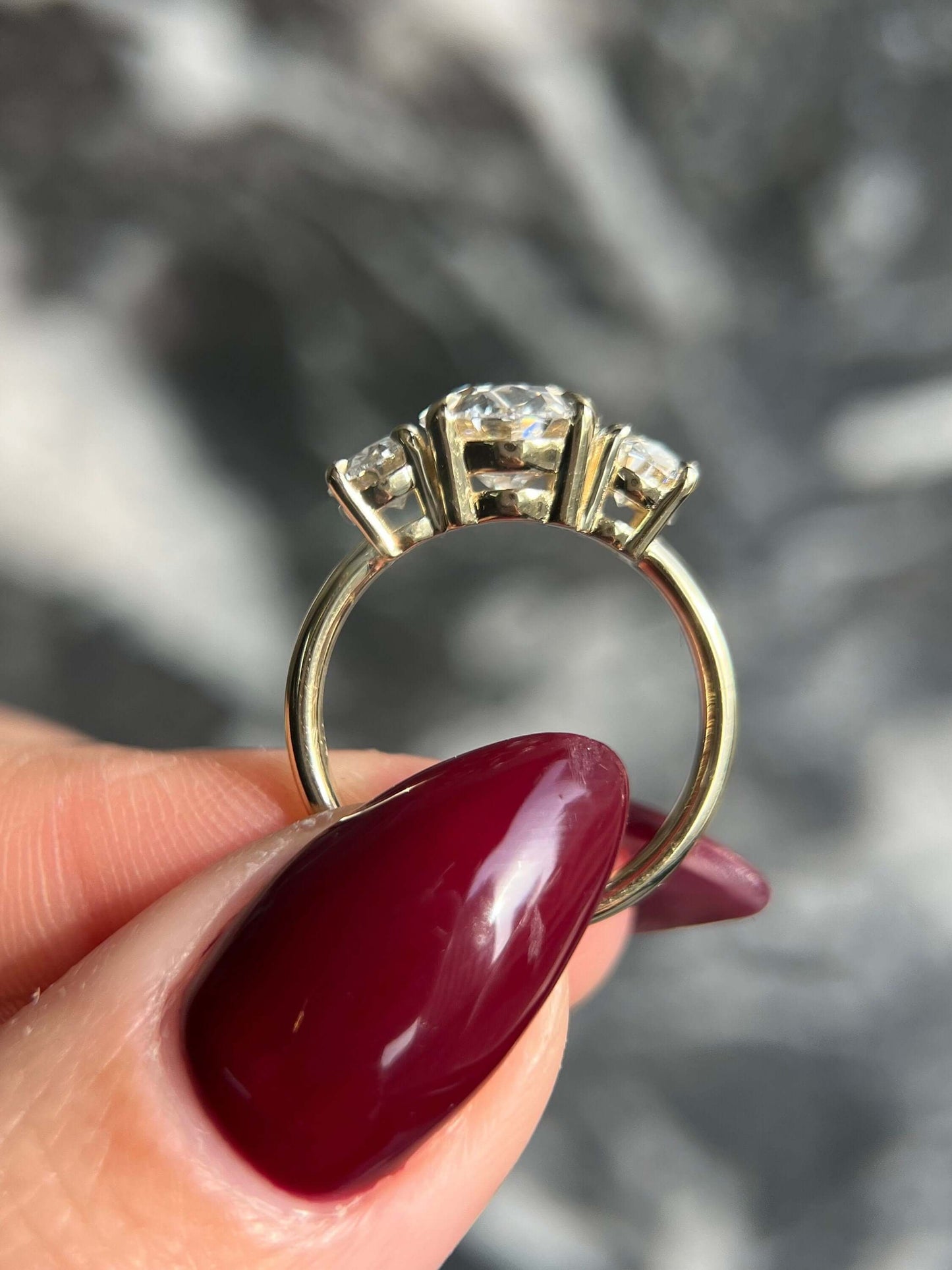 Oval Cut 5 Carat Lab Grown CVD Diamond Trilogy Three Stone Engagement Ring with an IGI Certified F Color VS1 Clarity Center Stone Diamond