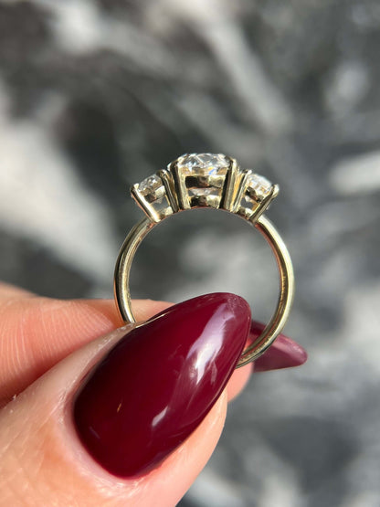 Oval Cut 5 Carat Lab Grown CVD Diamond Trilogy Three Stone Engagement Ring with an IGI Certified F Color VS1 Clarity Center Stone Diamond