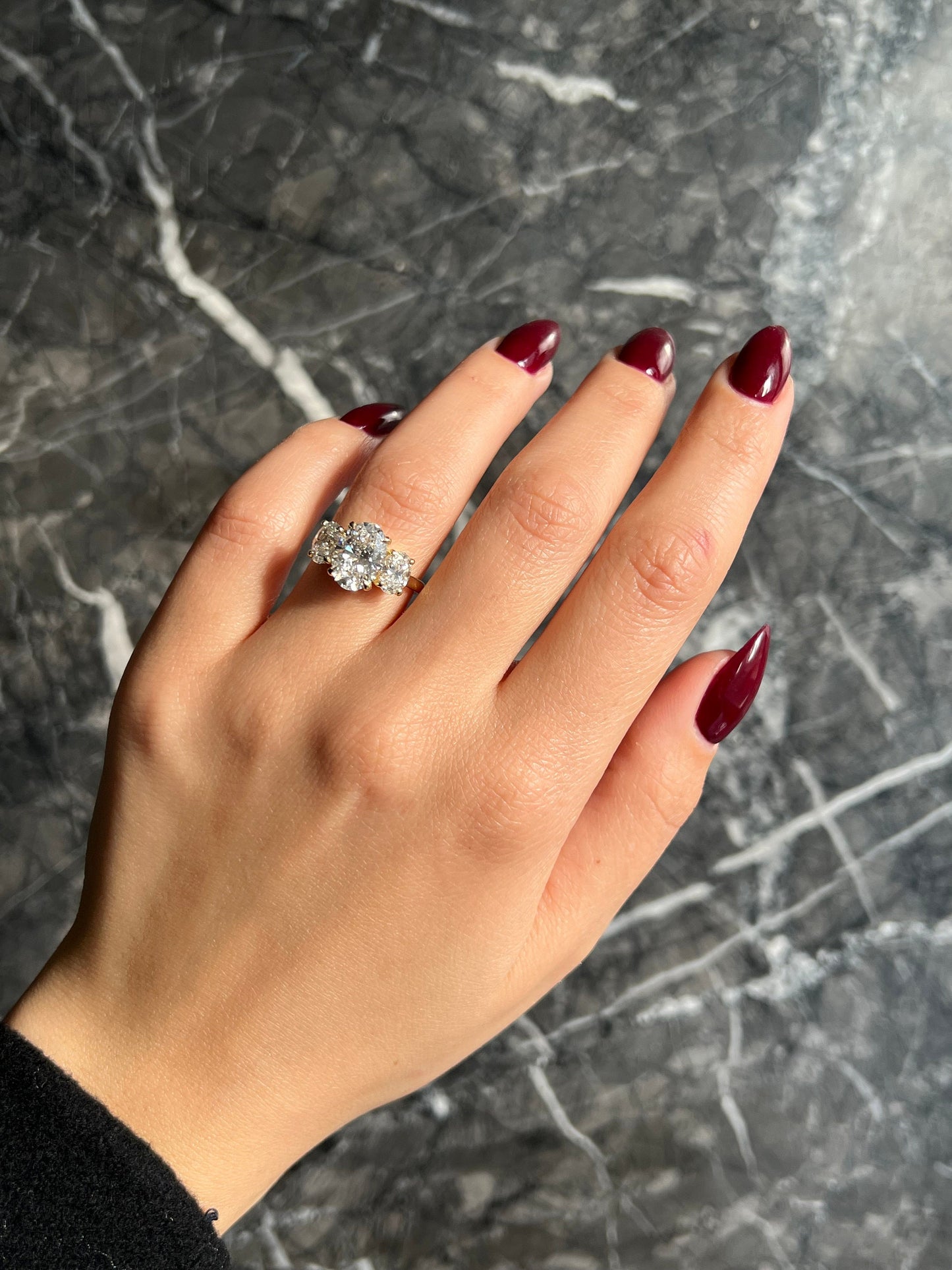Oval Cut 5 Carat Lab Grown CVD Diamond Trilogy Three Stone Engagement Ring with an IGI Certified F Color VS1 Clarity Center Stone Diamond